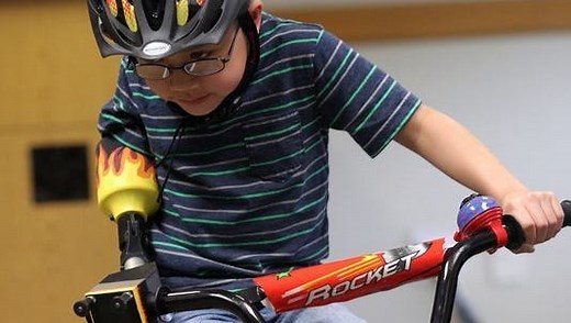 Engineering students help 8-year-old ride his bike
