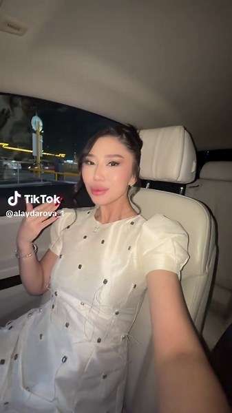 Stylish Nighttime Car Ride in a Chic Dress