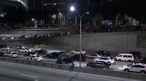 Freeway blocked, flags burned as thousands protest Trump win around US