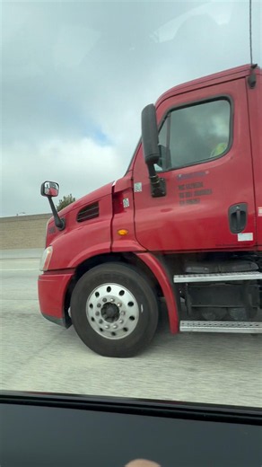 Red Freightliner Cascadia Daycab Truck