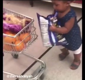parents take toddler to grocery store and she walks around with tiny shopping cart and fills it with food