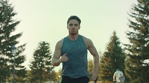 Young man running in park. sport man jogging outdoor. tired runner stop Premium Stock Video Footage