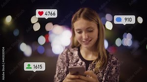 Beautiful Happy Caucasian Woman Using Smartphone with Social Media Icons Appearing. Social Network. Likes, Comments and Followers Counter Increasing. City at Night