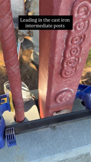 Pouring lead in to fix our cast iron intermediate posts. 22 panels in and only 6 to go! #perrybirdpickets #periodstyle #heritage #metalwork #castiron #fencing | Perry Bird Pickets