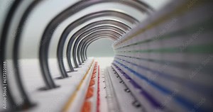 Notepad with paper sheets on spring and created archive of previous work reports. Book with reports and documents on desk macro