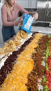 Nacho trick great for parties I create a nacho table that is so big it is perfect for parties! I add several layers of everyone's favorites. | Alexandra’s Kitchen