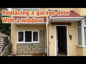 Replacing a garage door with a window and installing gutters