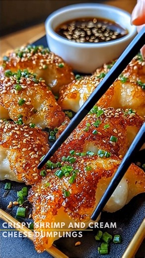 Crispy Shrimp and Cream Cheese Dumplings *There’s something so comforting about a warm, crispy appetizer fresh from the skillet—especially one that feels a little special without being complicated. These shrimp and cream cheese dumplings have that wonderful blend of simple ingredients and just-right richness that many of us remember from cherished family get-togethers.* What You'll Need 1 pound shrimp, peeled and deveined 4 ounces cream cheese, softened 2 cloves garlic, minced 2 green onions, fi