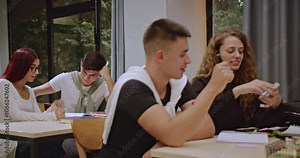 High school students collaborate on school projects during class with their professors guidance. The dedicated students actively participate, demonstrating teamwork and a commitment to education.