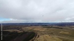 Flight following an aerial radio-controlled model aircraft in cloudy weather. Radio controlled hobby aerial flying models in the sky. Drone longevity