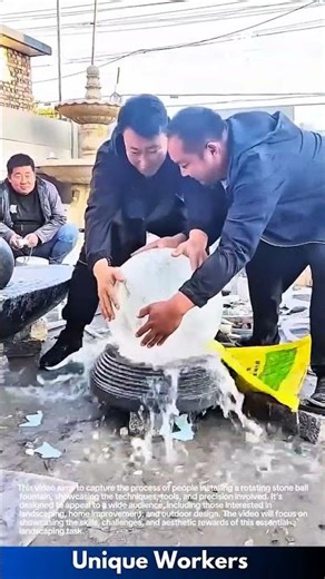 Rotating stone ball fountain: people installing a fountain