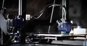 3D printer at work, focusing on the print head and the detail being created. 3D printing technology in modern manufacturing and prototyping.