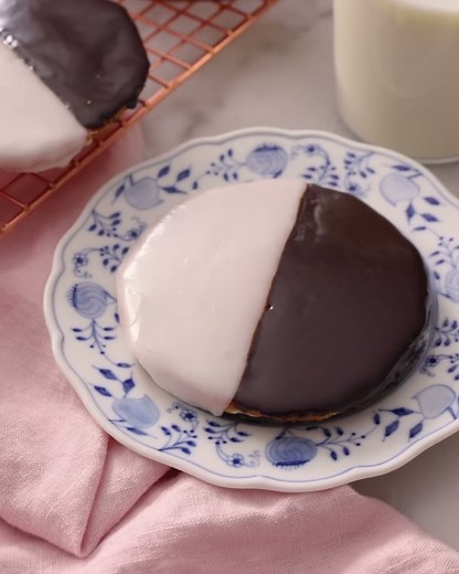 Perfectly soft and cake-like, my Black and White Cookie recipe is topped with vanilla and chocolate icing, giving the best of both worlds! | Preppy Kitchen