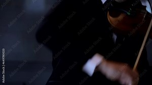 The violinist performing and playing the violin