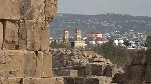 Contrast between ruins of Kato Pafos Archaeological site and recently built Orthodox church in Pafos, religion and history Cyprus