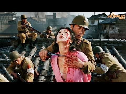 A girl spots the Japanese lying in ambush on the roof, but is silenced by a blade to the throat!