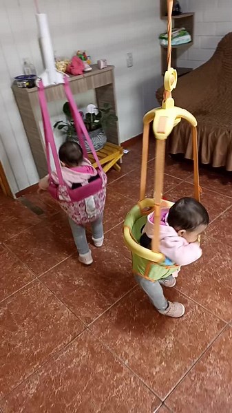 Joyful Toddlers Bouncing in Colorful Jumpers