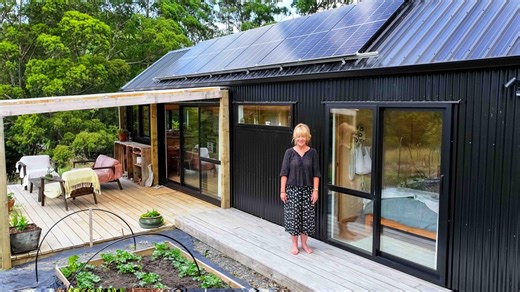 Christina’s tiny home is more than just a house—it’s a sanctuary. Thoughtfully designed to meet her every need, this stunning off-grid home allows her to embrace simplicity while being completely supported by her surroundings. With a strong connection to nature and a design that nurtures both body and soul, this space truly takes care of her. | Living Big In A Tiny House