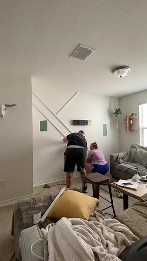 Modern accent wall in sherwin williams “privilege green” | Gerber Design Co