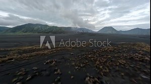 Fpv drone dive from mountain to group dirt bike Enduro riders speed off road cross volcano valley aerial low view. Extreme sport motorcycle motorbike race at black cliff rock alpine river park 4k