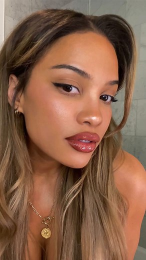 Andrea Brooks on Instagram: "My fav drugstore lip combo right now. Let’s get ready togeth ❤️ Brows: * @elfcosmetics brow brush featuring teeth marks from dog * @urbandecaycosmetics brow blade in dark drapes * @kosas brow gel in brown black Lips: * @nyxcosmetics lip liner in cocoa * @elfcosmetics lip plumping gloss in mocha twist Top is from @nastygal"