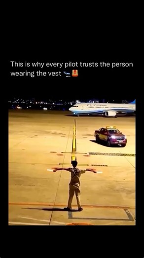 Inspiration🚀 Success♠ Money💰 on Instagram: "Every massive jet you see taxiing on the runway is being guided by a single person in a reflective vest! They’re called aircraft marshals—unsung heroes of the tarmac. When visibility drops, cockpits have blind spots, and precision is critical, pilots rely solely on the marshal’s hand signals to navigate safely. The pilot may steer the plane, but it’s the marshal who directs thousands of tons of steel with pinpoint accuracy to where it needs to go. #h
