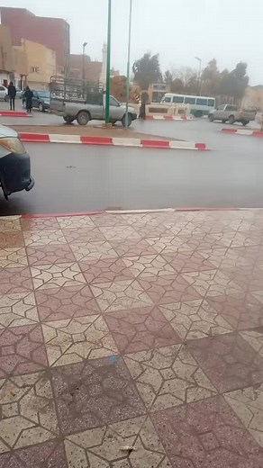 Urban Street Scene with Pedestrians and Vehicles