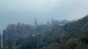 Fog during daytime all over the lake Balaton in Hungary during autumn, with views from Tihany