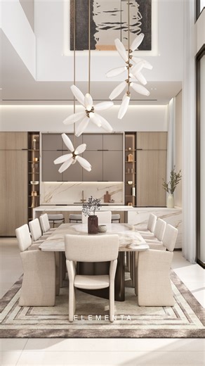 Elementa Interior Design on Instagram: "A space in motion. This moving render brings the kitchen and dining area to life, revealing how light, materials and proportion work together as one continuous experience. From the sculptural stone island to the softly framed dining space beyond, every detail is designed to feel calm, cohesive and quietly luxurious. A glimpse into how we shape spaces that flow effortlessly from one moment to the next. #ElementaInterior #InteriorDesign #KitchenDesign #Dinin