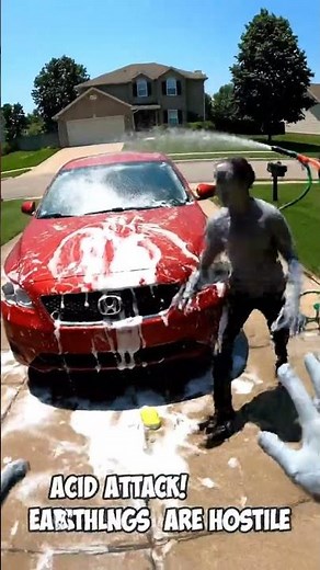 Grey Alien Panics While Washing Stolen Human Car