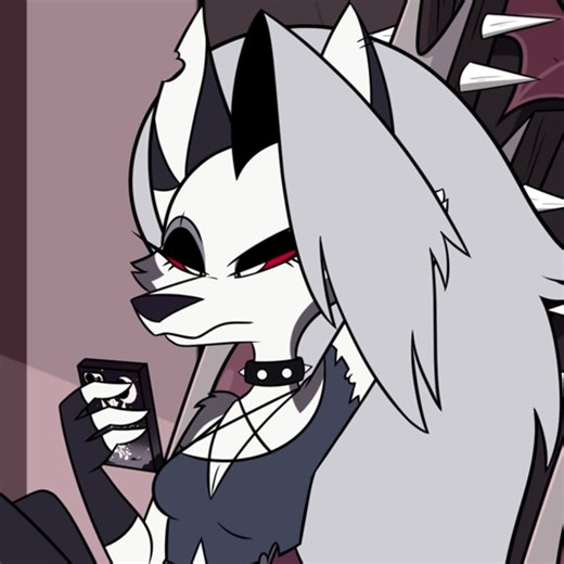 Just a cute wolf checking her phone #helluvaboss