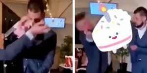 Groom has extreme reaction after wedding guest throws cake at him and his bride