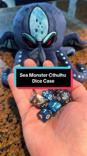 Casmatix Cthulhu Plush sea monster dice case that stores up to 21 RPG dice and includes a full 7-piece DND dice set. #dnd #cthulhu #seamonster #dicecase #tabletopgames DND dice case RPG dice storage tabletop gaming accessories Cthulhu dice holder plush Dungeons and Dragons dice set