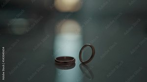 Wedding rings on the table. One ring rotates for a long time. High quality FullHD footage