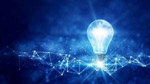 business idea creative concept technology. A light bulb illuminated above a polygon on a dark blue background.