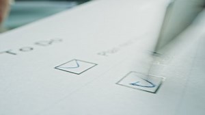 Person Ticks Checkbox Marks with a Pen, filling up To Do List. Checking Marks and FIlling in a Task List / Questiannaire / Medical Cart. Moving Macro Close-up Camera