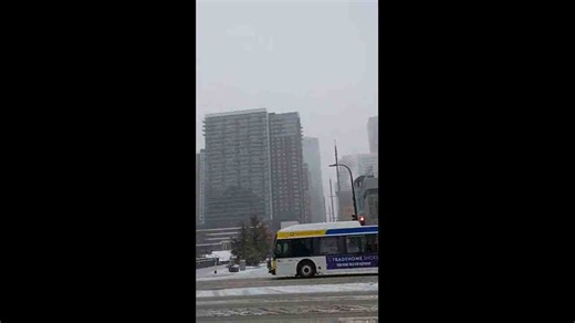 Heavy snowfall begins covering streets and buildings, Minneapolis, USA
