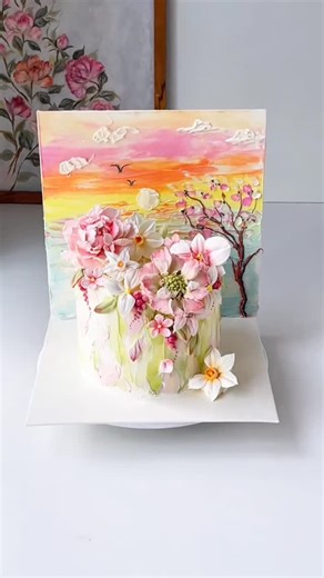 Cake Crafts - Bake With Expert on Instagram: "Hand-Painted Floral Palette Knife Cake with 3D Buttercream Flowers and Sunset Backdrop Art #PaletteKnifeCake #FloralCakeArt #3DButtercreamFlowers #floralCake #beancreamflower"