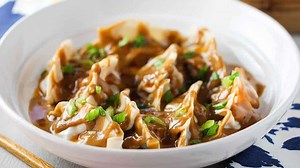 Pork Dumplings with Spicy Peanut Sauce