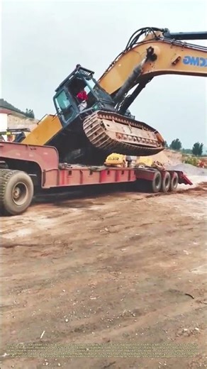 Tracks on the Ramp: The Controlled Offload of an Excavator
