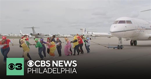 Dressed as Mario Bros. and crayons, hundreds take part in Ronald McDonald House "plane pull" event
