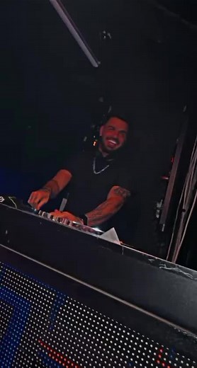DJing Techniques in a Vibrant Club Environment