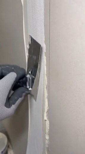Drywall Finisher Embedding Joint Tape with Putty Knife 🧰 | Renovation Skill
