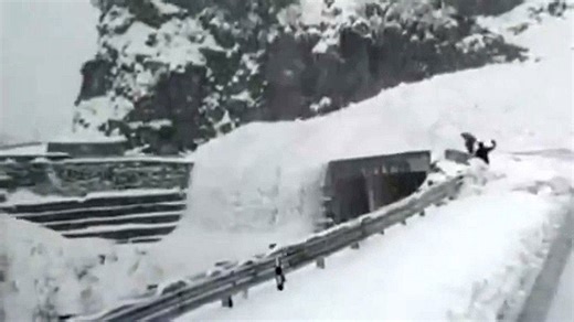 Avalanche pours off cliff like snowy waterfall in India