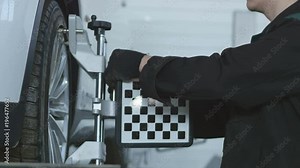 Diagnosis of the tilt of the car wheels with the device Stock Video