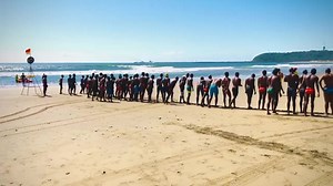 Exciting Male Swimming Race on the Beach