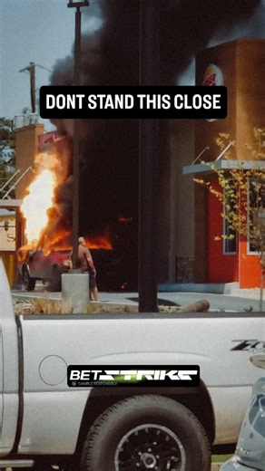 BoomBlastExplosion on Instagram: "What looks like a routine vehicle fire turns catastrophic in seconds. While the white Silverado appears dangerously close, the real threat is the red pickup parked directly against the Burger King. At 0:13, the incident crosses the line from a vehicle fire to a structural threat. The smoke darkens into thick, oily black—an indicator that fuel systems have been compromised. That’s when thermal radiation becomes the real killer. The heat output at this stage is en