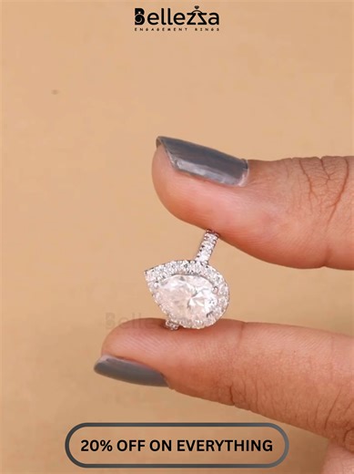 Pear Diamond Halo = Pure Magic 💍✨ A graceful pear-cut diamond surrounded by a sparkling halo for that extra wow 💎 Elegant, feminine, and made to shine from every angle. Is this your dream engagement ring? 😍 #PearDiamondRing #HaloSetting #EngagementRingTok #RingGoals #BridalJewelry #LuxurySparkle #SheSaidYes