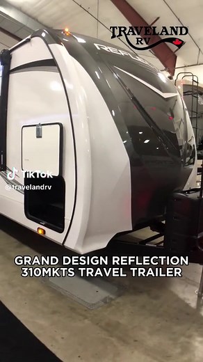 Experience luxury on the road with the Grand Design Reflection 310MKTS Travel Trailer - 37 feet of pure comfort and style. With a weight of 9,516 pounds, this spacious trailer can comfortably sleep up to 6 people and features 3 slides for maximum living space. Whether you're planning a family adventure or a romantic getaway, the Grand Design Reflection 310MKTS is the perfect home away from home. #TLRV #TravelandRV #rvlife #Glamping #Camping #traveltheland #rvtravel #rvliving #gorving #happycampe