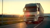 Front-View Camera Follows Semi-Truck with Cargo Trailer Driving on a...